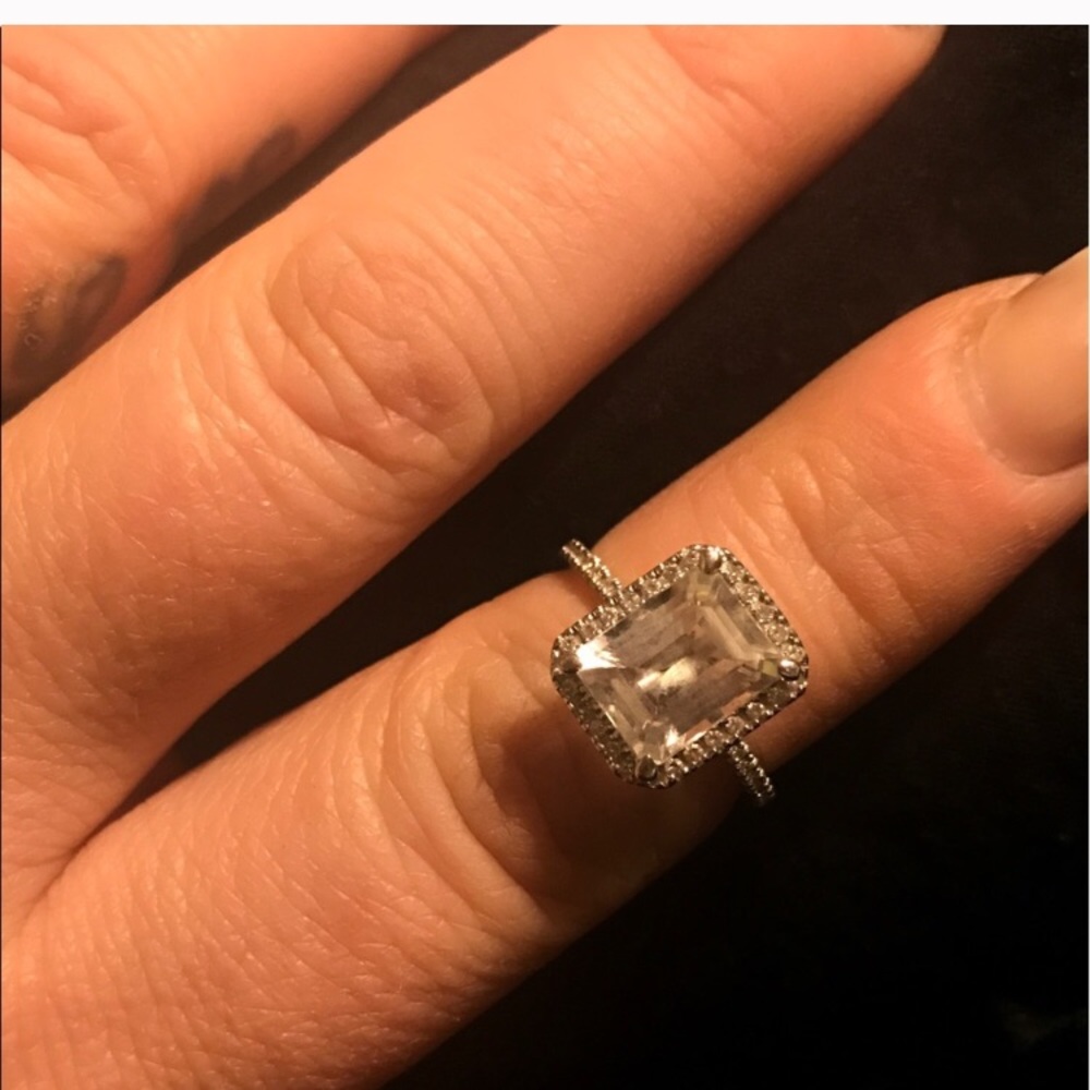 Emerald cut 2 carat topaz with diamond halo.